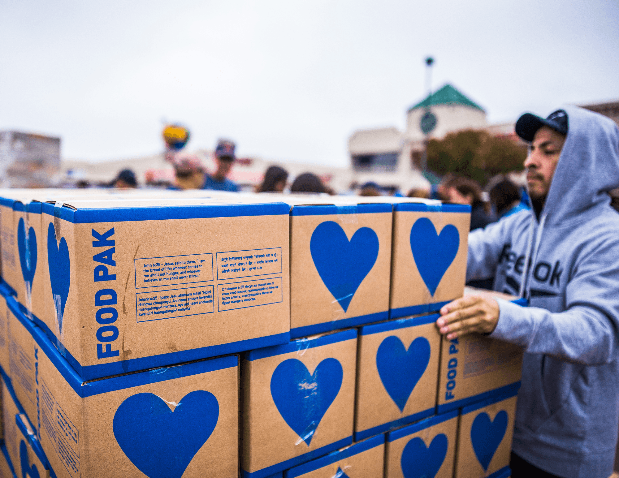 Volunteer sorting donation boxes